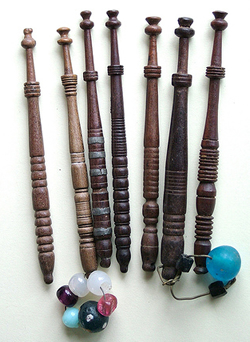 Seven bobbins turned by the same maker